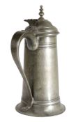 An unusual pewter George I knopped flagon, circa 1715 Having an all-over hammered tapering