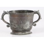 An exceptional and rare Charles II pewter twin-handle cup, circa 1670 The body with reeded rim and