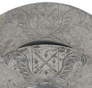 A rare pair of Charles II pewter broad rim plates, circa 1660 Each rim engraved with the mantled