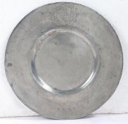 A rare Charles I pewter broad rim plate, Devon, circa 1630 The rim engraved with the arms of the
