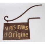A wrought iron vineyard sign with bracket, circa 1920, the rectangular sign inscribed "VINS FINS d'