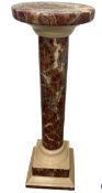 A 20th century ceramic pedestal/plant stand with Rouge marble effect and of classical design, 79cm