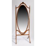 An Edwardian painted cheval mirror, circa 1910, the foliate and insect painted arched pediment