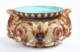 A Majolica jardiniere probably by George Jones, grey/brown ground embossed with flowers, buds and