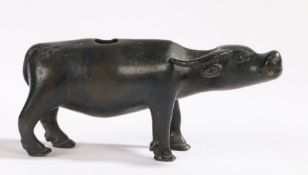 A late Ming Dynasty bronze water dropper of a bull with hole to rear end, circa 1600, 12cm wide