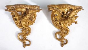 A good pair of George III carved giltwood wall brackets, the serpentine fronted tops above