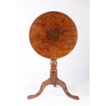 A late George III yew and burr-yew tripod occasional table, circa 1820 The circular tilt-top with