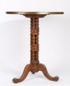 A Victorian oak, ebony and boxwood "Bullseye" occasional table, the circular top with brass rim,