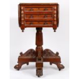 In the manner of Gillows a mahogany work table, the square top with drop leaves above three