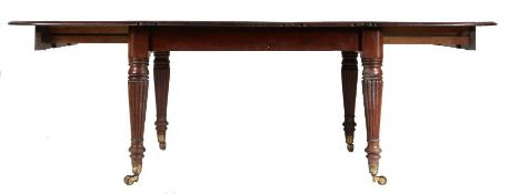 A Victorian mahogany D end dining table, the chamfered top with two additional leaves, raised on