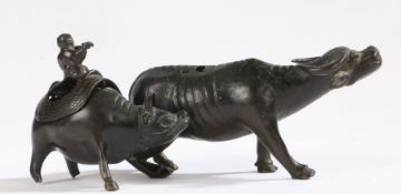 A late Ming Dynasty bronze of a flute player mounted on a bull, circa 1600, together with a late