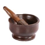 An 18th century ash mortar footed bowl, with original pestle, English Of squat tulip-shaped form,