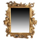 A Victorian carved and gilt wall mirror, the bevelled mirror plate housed in an acanthus leaf and