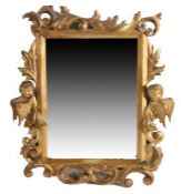 A Victorian carved and gilt wall mirror, the bevelled mirror plate housed in an acanthus leaf and
