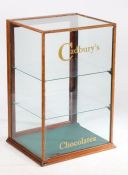 An Early 20th Century shop cabinet for Cadbury's Chocolate, the fully glazed cabinet with rear