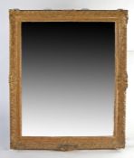 A large 19th century gilded wall mirror of rectangular form, with ornate swag border, 156cm tall,