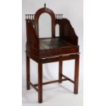 A Victorian clerk's desk, circa 1860, the arched front with frosted glazed panel etched with royal