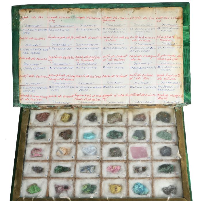 An unusual malachite book form specimen box, the hinged lid opening to reveal thirty mineral