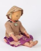 Helena Paderewski Polish Victims Relief Fund doll, modelled as a blond haired girl, with medallion
