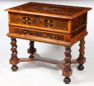 A William and Mary oyster veneered and marquetry inlaid side table, the hinged top with foliate