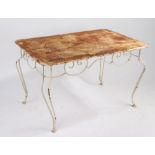 A French iron garden table, circa 1920, the pierced rectangular top above a scrolled frieze,