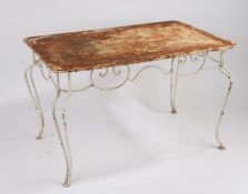 A French iron garden table, circa 1920, the pierced rectangular top above a scrolled frieze,