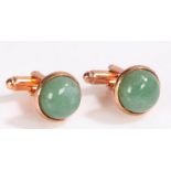 Pair of Jade and yellow metal cuff-links, set with a cabochon cut jade stone