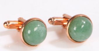 Pair of Jade and yellow metal cuff-links, set with a cabochon cut jade stone