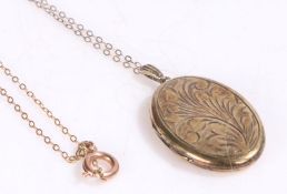 Silver gilt locket containing a locket of hair, hallmarked for Birmingham