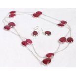 Silver and red faceted stone necklace and earring set, formed of pear shaped faceted red stones