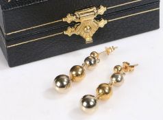 Pair of 18 carat gold drop earrings, decorated with graduating spheres, stamped 750, weight 2.2