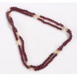 Pearl and red stone beaded necklace, with a row of red stones intersected by pearls, 80cm long