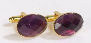 Pair of amethyst and yellow metal cuff-links, set with oval faceted stones