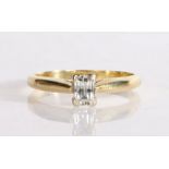 An 18 carat gold princess cut diamond set solitaire ring, the central diamond at 0.47 carat with