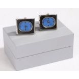 Pair of watch cuff-links, the cuff-links set with a blue oval dial and Roman numerals housed