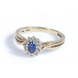 9 carat gold sapphire and diamond ring, the head set with a claw mounted oval cut sapphire