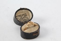 18 carat gold ring, the head in the form of a knot, ring size J weight 3.5 grams housed within a