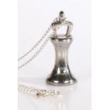 A sterling silver novelty fob pendant on a chain, signed L&S, weighing 18.35 grams. The fob in the
