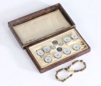 Sterling silver and mother of pearl stud set, housed in a leather box