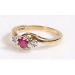 9 carat gold ruby and diamond ring, the head set with a claw mounted ruby together with a pair of