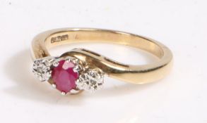 9 carat gold ruby and diamond ring, the head set with a claw mounted ruby together with a pair of