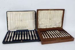 Two cased sets of silver plated fruit knives and forks, the first by Mappin & Webb, housed in an oak
