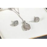 Suit of 9 carat white gold and diamond jewellery to include a pendant and chain and a pair of