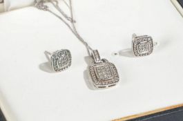 Suit of 9 carat white gold and diamond jewellery to include a pendant and chain and a pair of