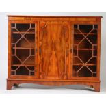Reproduction yew wood glazed cabinet, having a pair of astragal glazed doors flanking a central