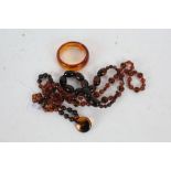 A Collection of Bakelite style items, to include bangle and three necklaces (4)