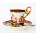 A 19th/20th century Decorative cabinet cup and saucer, depicting classical figural scenes to the