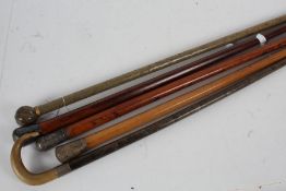 Collection of five walking sticks, some with silver and horn pommels, (5)