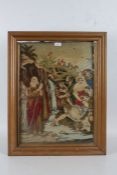 A Wool work picture depicting a religious scene, housed within a gilt and glazed frame, 67cm by 52cm