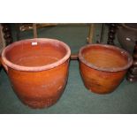 Terracotta pot with scrolled handles, 41cm diameter, and another smaller terracotta pot, 40cm